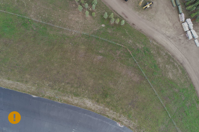 Orange exclamation mark in lower left. Uncalibrated image.